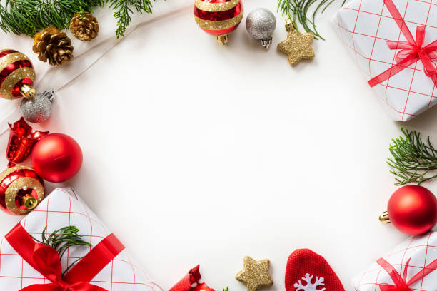 istock Christmas background concept. Christmas gift box with red ball and pine cones on white background. 1042127828