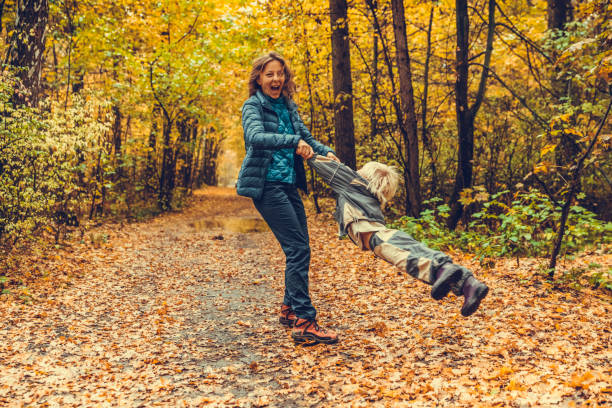 Mother and child in the park in autumn day