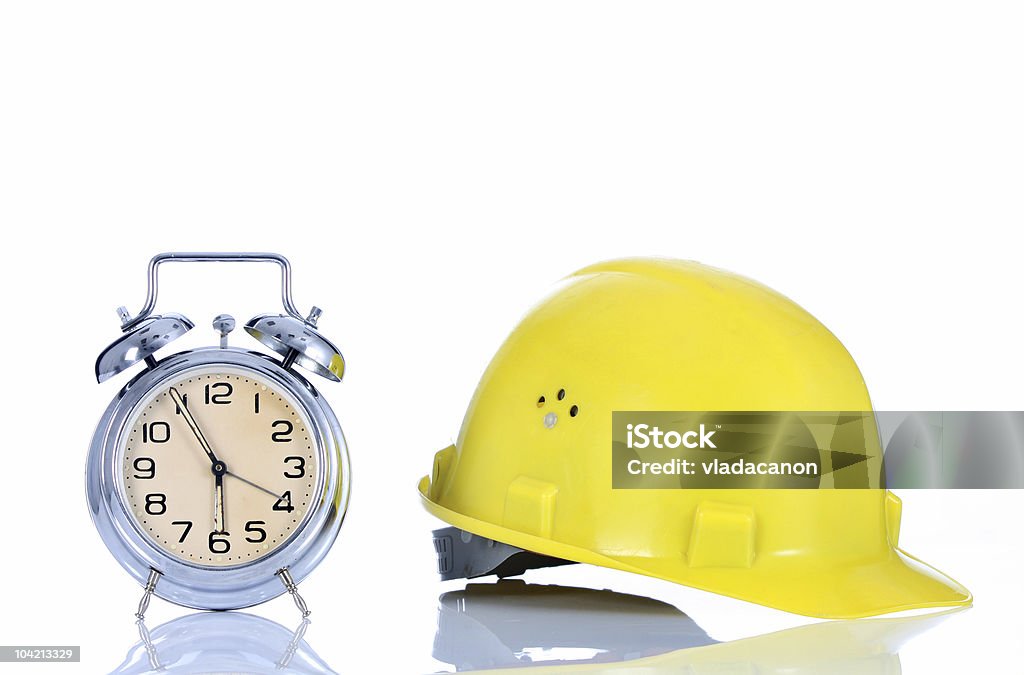 Reloj despertador y casco - Foto de stock de Aguja de Reloj libre de derechos