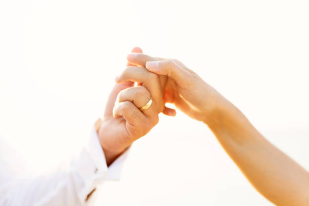 Just married couple holding hands