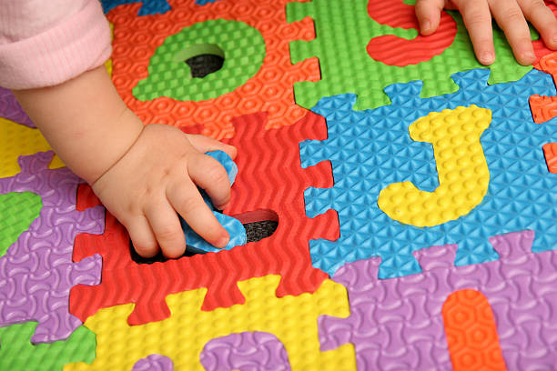 istock Child playing with foam puzzle to learn 104213957