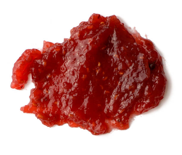 istock Spread strawberry jam over white isolated background 1042145770