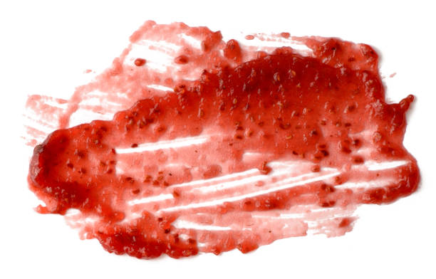istock Spread strawberry jam over white isolated background 1042145794