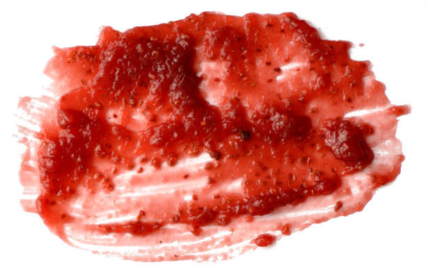 istock Spread strawberry jam over white isolated background 1042145836