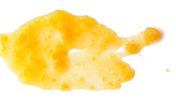 istock Spread apricot jam over white isolated background 1042146072