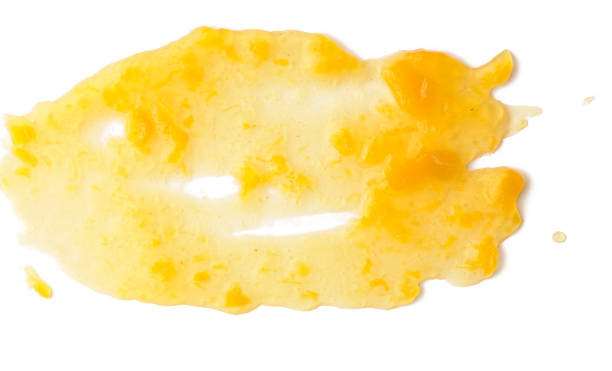 istock Spread apricot jam over white isolated background 1042146074