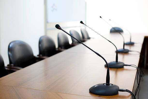 istock Mircophones in board room close-up 104214936