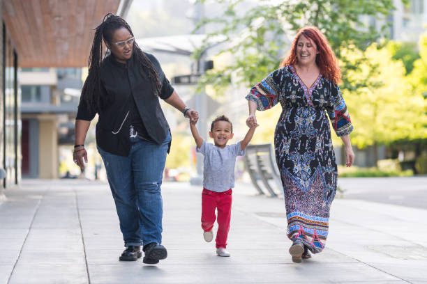 istock Female couple walking with their son 1042152790