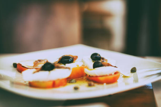 Image of cheese and tomato tower with basil oil.All my images have been processed in 16 Bits and transfer down to 8 before uploading.