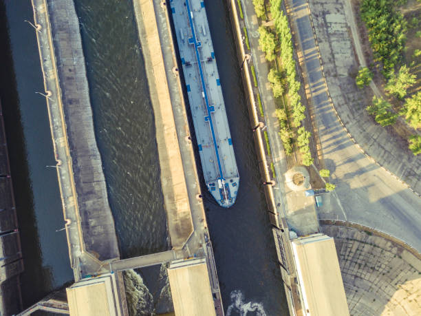 istock aerial drone shot of river gateway structure for barge cargo ships f 1042154126