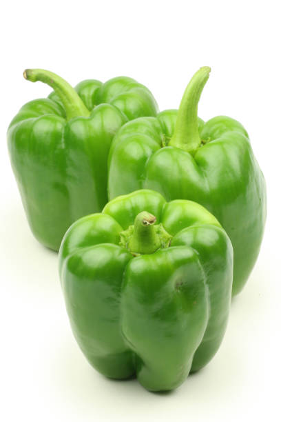 istock Green peppers separated on a white background 1042154180