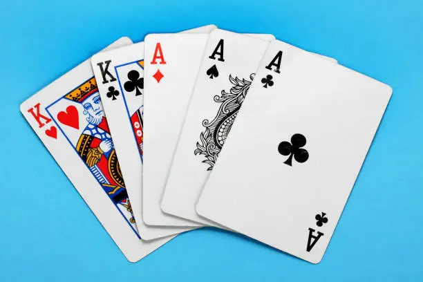 Photo of Hand of Cards on blue background