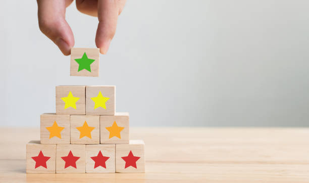 istock Hand arranging wood block stacking with icon five star symbol. Rating customer service satisfaction experience concept 1042157166