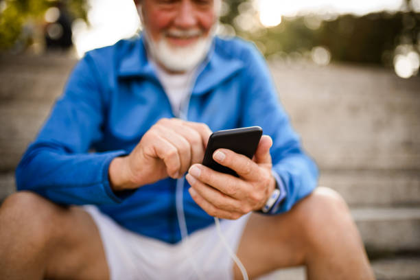 istock Close up of a senior man using mobile phone. 1042160412