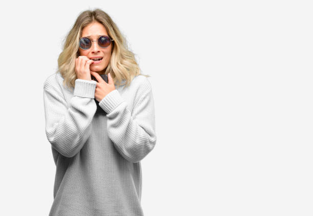 istock Young beautiful woman using smartphone terrified and nervous expressing anxiety and panic gesture, overwhelmed 1042160472