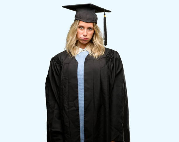 istock Young graduate woman with sleepy expression, being overworked and tired 1042161110