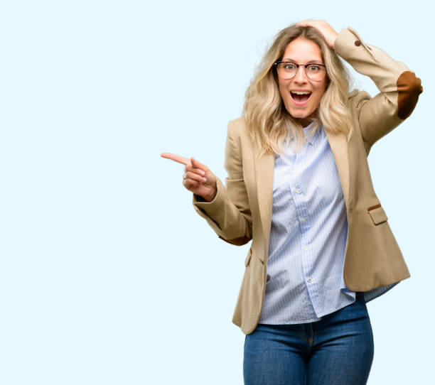istock Young beautiful woman pointing away side with finger 1042161712