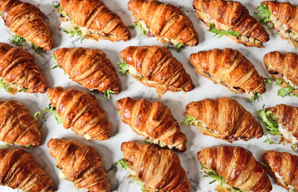 Chicken salad croissant sandwich Chicken salad croissant sandwich on buffet table breakfast sandwhich stock pictures, royalty-free photos & images