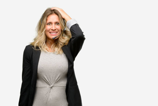 istock Young woman operator from call center terrified and nervous expressing anxiety and panic gesture, overwhelmed 1042162174