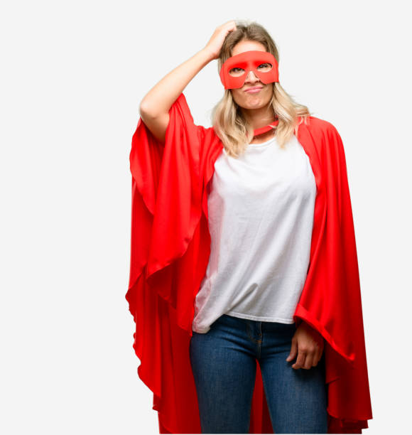 Young super hero woman wearing cape doubt expression, confuse and wonder concept, uncertain future