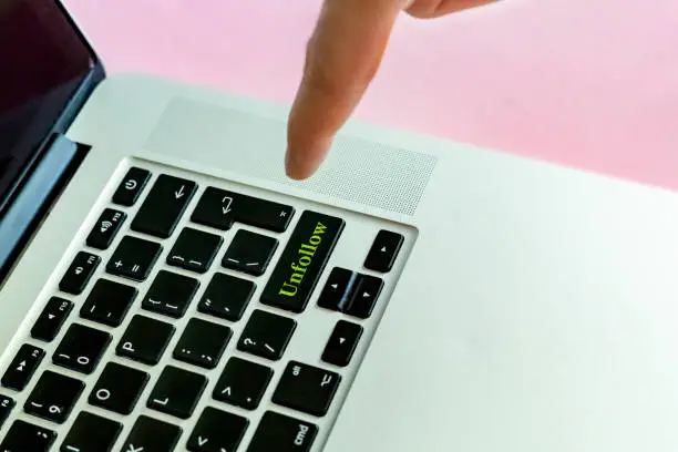 Photo of close up person's hand finger pushing the 