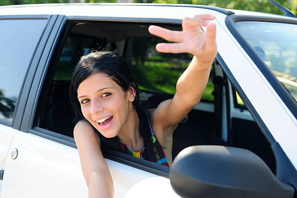 istock owner of a new car: young  woman is happy 104218395