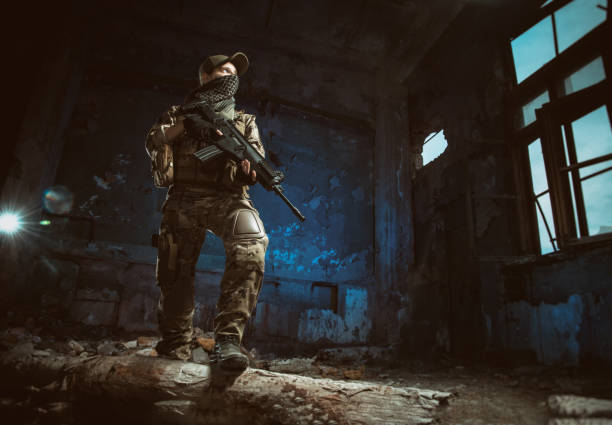 istock the people in uniform with weapons in the ruins 1042208630