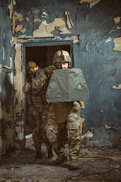 istock the people in uniform with weapons in the ruins 1042208632