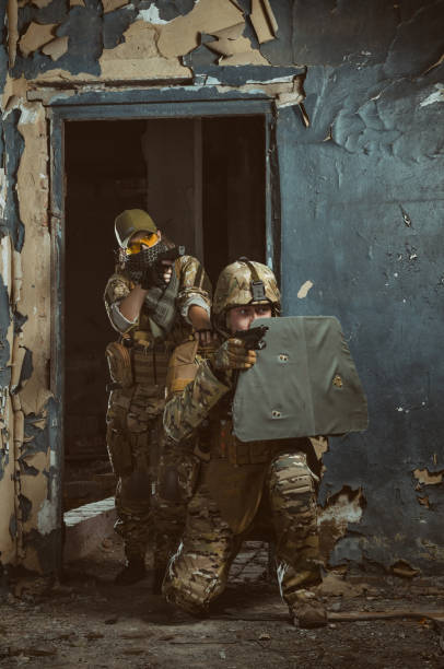 istock the people in uniform with weapons in the ruins 1042208638