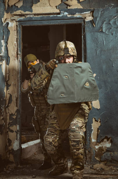 istock the people in uniform with weapons in the ruins 1042208640