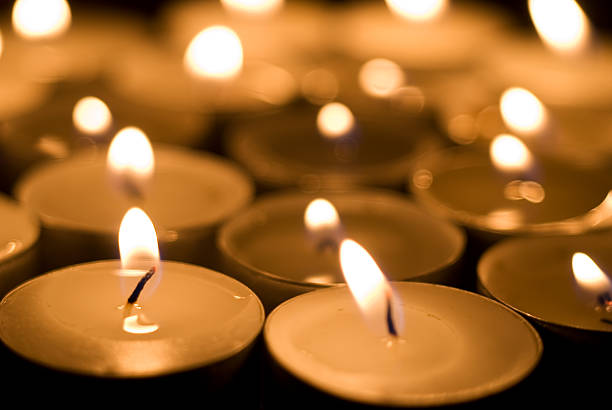 istock Row upon row of lit tea lights 104221298