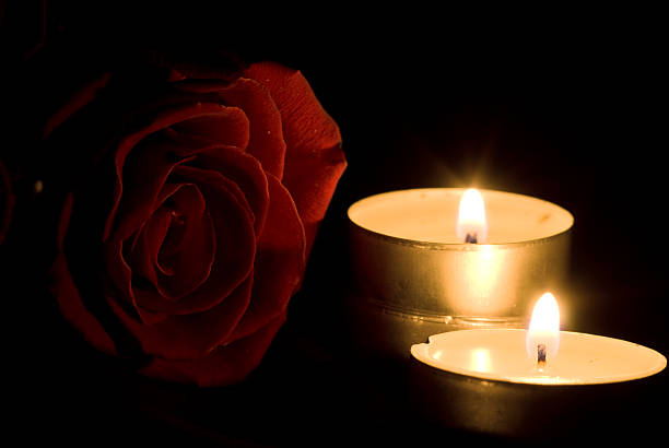 istock red rose and candles in the darkness 104221376