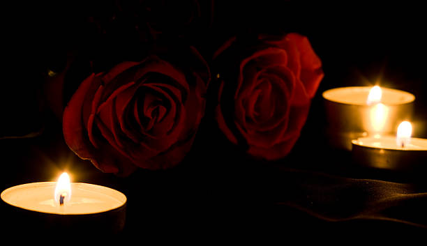 istock red rose and candles in the darkness 104221385