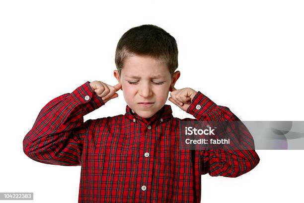 Young Boy In Plaid Shirt Covering His Ears Stock Photo - Download Image Now - Sensory Perception, 6-7 Years, Boys