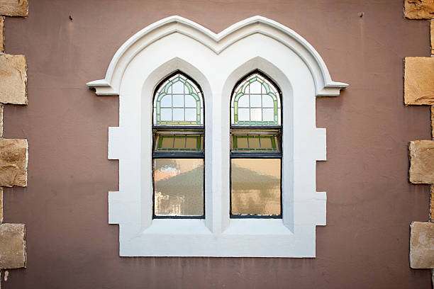 istock Old style church windows in brown wall 104222570