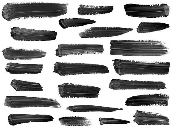 Photo of Collection of artistic paint streaks isolated on white
