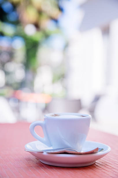 istock blurred background of espresso on the table in the garden 1042228708
