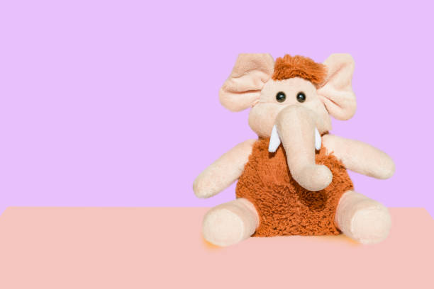 istock Soft toy beige with brown wool mammoth elephant isolated 1042229446