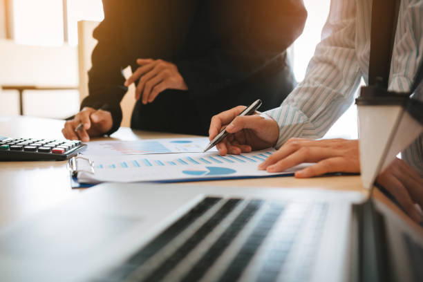 istock Business people working on desk and analysis summary chart with calculate about cost at office room. 1042236368