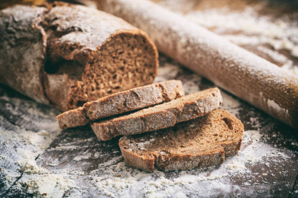 istock Baked sliced bread on a wooden surface 1042240444
