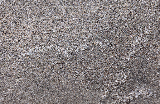 A top down shot of a dry river sand bottom full of texture and salt marks. Useful as abstract background.