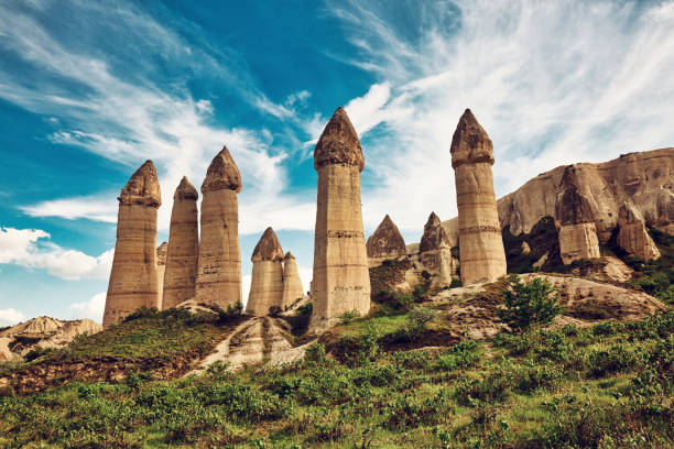 Unique geological formations in Love Valley in Cappadocia, popular travel destination in Turkey Unique geological formations in Love Valley in Cappadocia, popular travel destination in Turkey valley stock pictures, royalty-free photos & images
