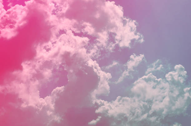 istock Nature background. Fluffy soft clouds in sky toned. 1042253196