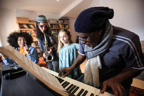 istock Group playing music at home 1042264110
