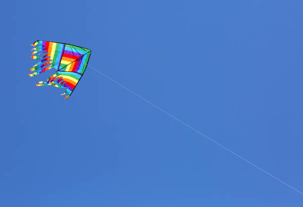 istock colorful kite flying on the blue sky in summer 1042281136
