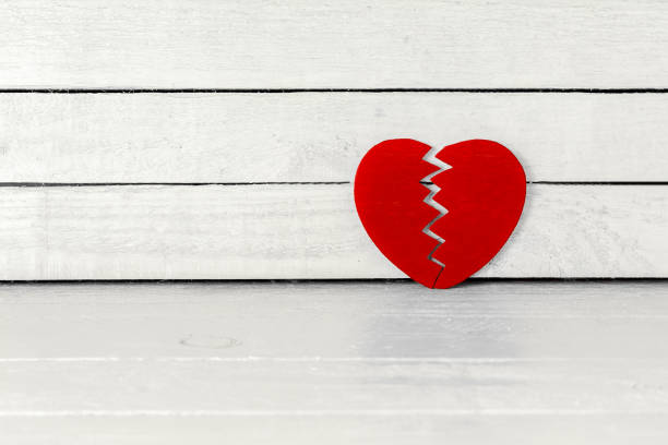Brokend Heart over white wood background