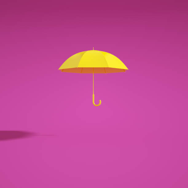 istock Yellow flying umbrella isolated on purple 1042289020