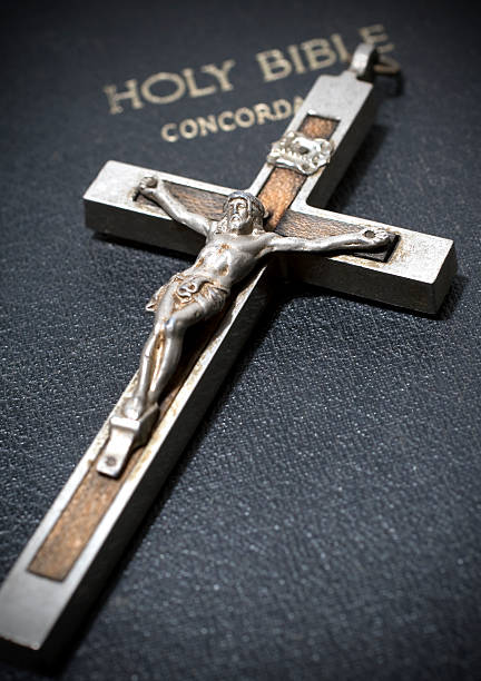 istock Jesus Crucifix Laying On A Black Bible 104229243