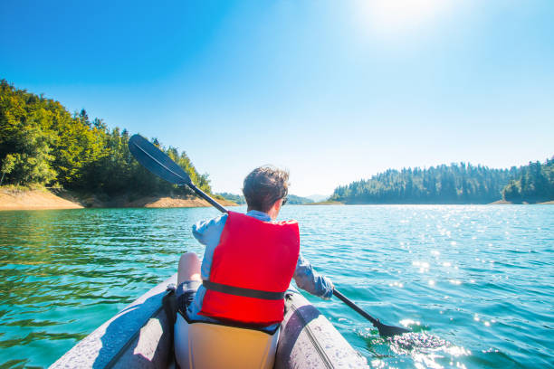 istock Girl kayaking on the lake 1042293984