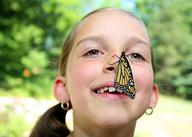 istock Girl with Monarch Butterfly on Her Nose 104231257